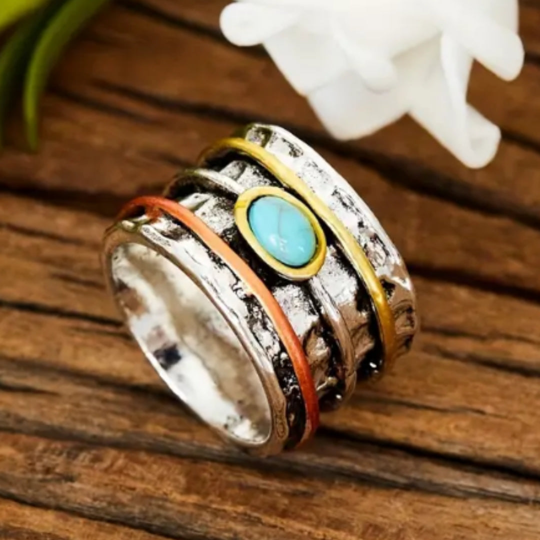Silver ring with light blue gemstone