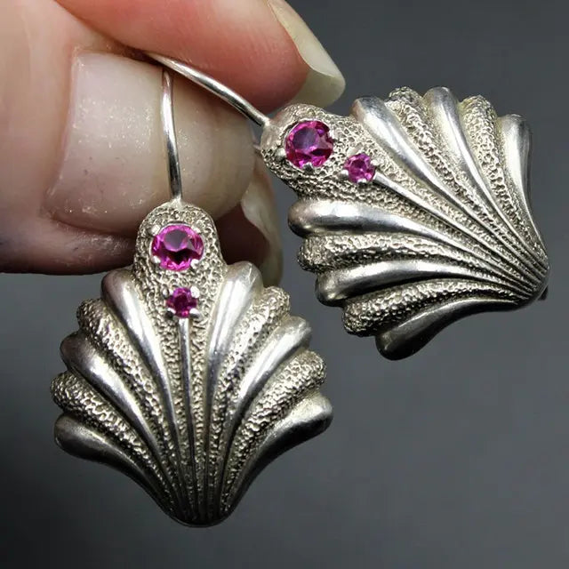 Vintage shell earrings with purple crystals